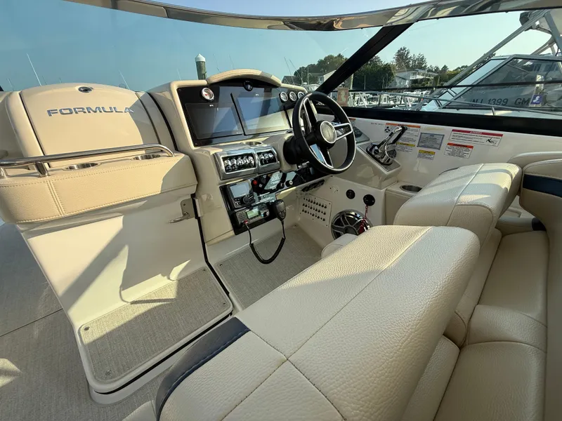 Slide: The Image of 2024 Formula 350 Crossover Bowrider interior with steering wheel and dashboard controls. - 20