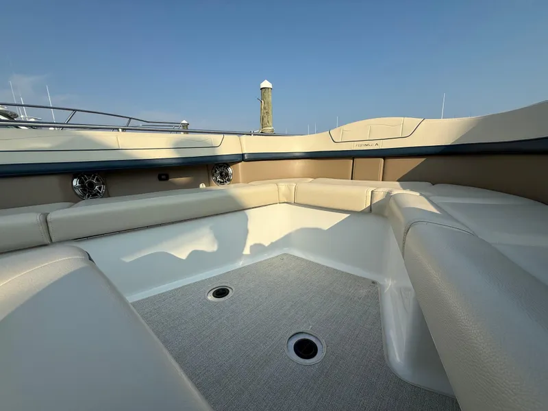 Slide: The Image of 2024 Formula 350 Crossover Bowrider interior with beige seating and speakers. - 26