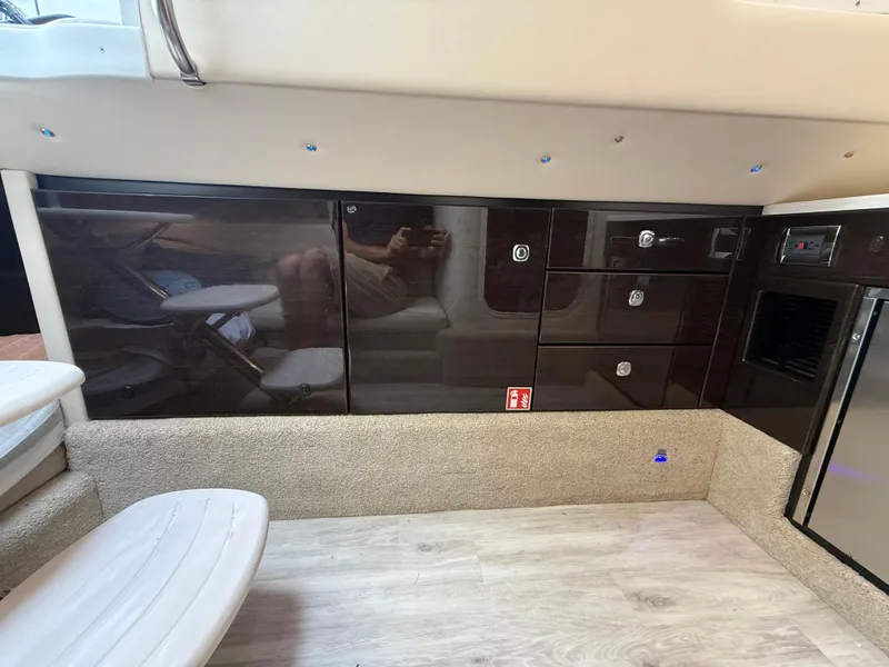 Slide: The Image of 2024 Formula 350 Crossover Bowrider interior with sleek cabinetry and modern design. - 40