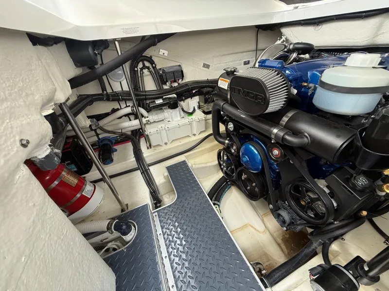 Slide: The Image of Engine compartment of 2024 Formula 350 Crossover Bowrider, showcasing detailed mechanical components. - 48