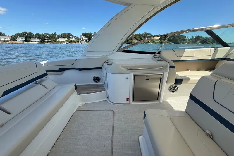 Slide: The Image of 2024 Formula 350 Crossover Bowrider interior with luxurious seating and scenic water view. - 5