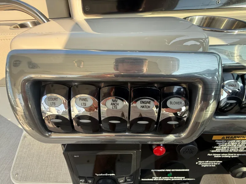 Slide: The Image of Control panel of 2024 Formula 350 Crossover Bowrider with labeled switches and buttons. - 53