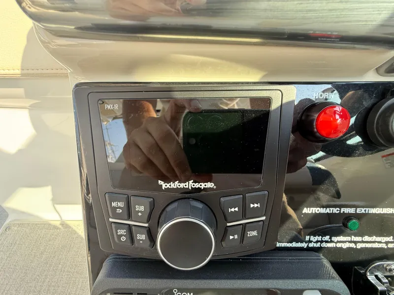 Slide: The Image of 2024 Formula 350 Crossover Bowrider dashboard with Rockford Fosgate audio controls. - 61