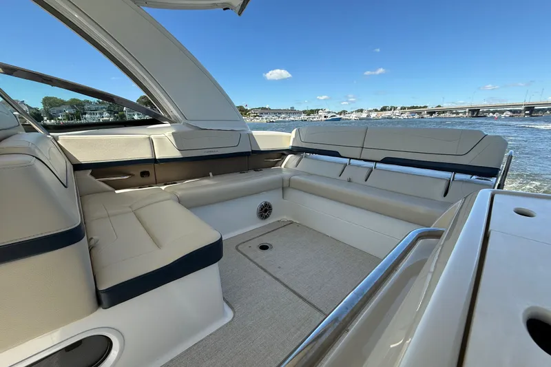 Slide: The Image of 2024 Formula 350 Crossover Bowrider interior with luxurious seating and scenic water view. - 67