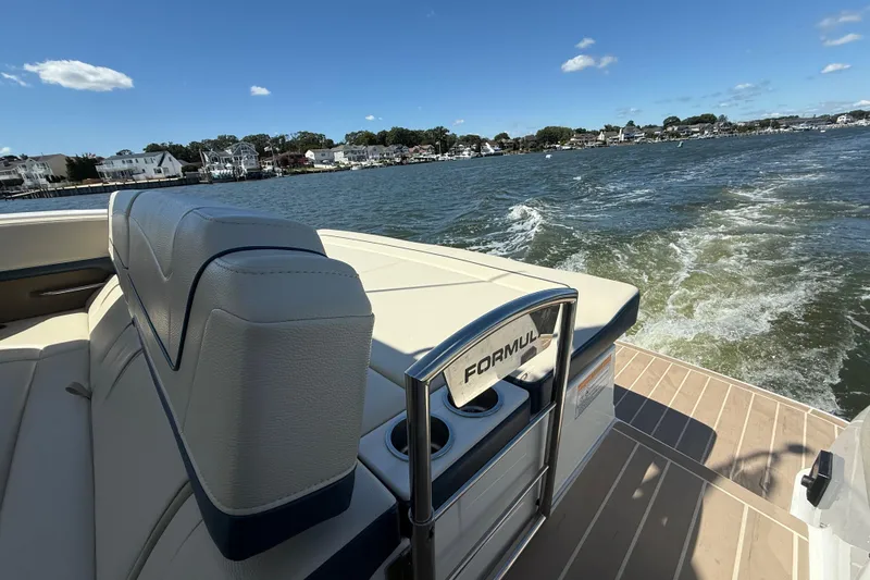 Slide: The Image of 2024 Formula 350 Crossover Bowrider cruising on a sunny day, showcasing luxury seating. - 72