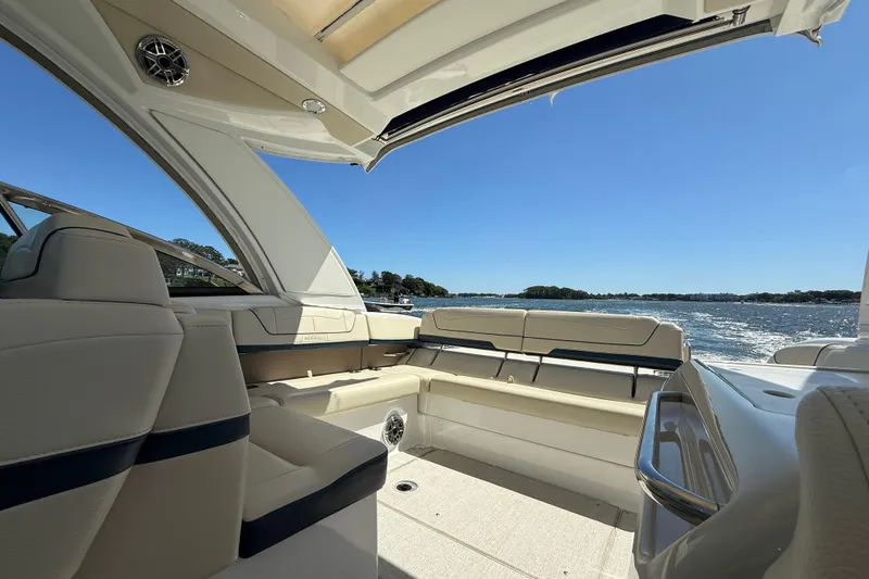 Slide: The Image of 2024 Formula 350 Crossover Bowrider interior with open deck, overlooking serene waters. - 73