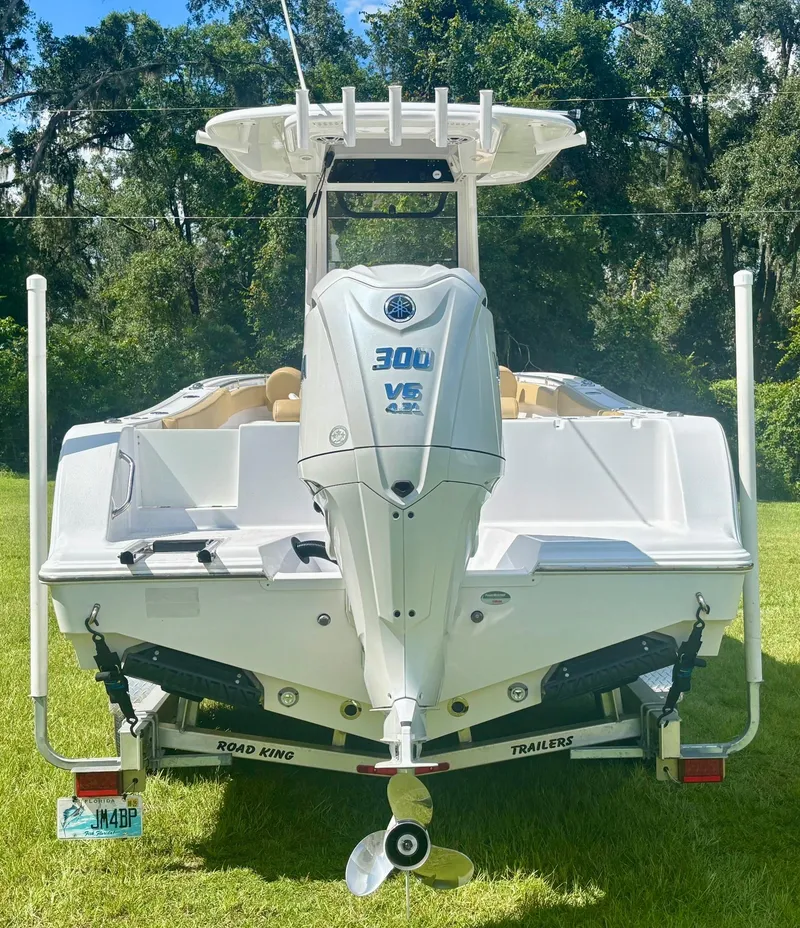 Slide: The Image of 2024 Sportsman Open 232 Center Console boat with Yamaha 300 V6 engine on trailer. - 6