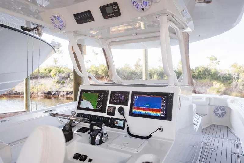 Slide: The Image of Helm of 2021 Tag 360 Catamaran with advanced navigation displays and controls. - 11