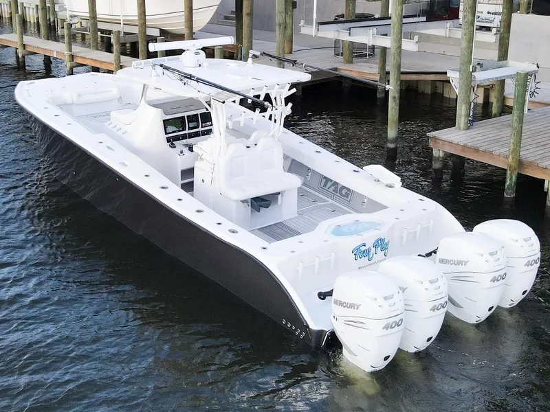 Slide: The Image of 2021 Tag 360 Catamaran with four Mercury 400 engines docked at marina. - 3