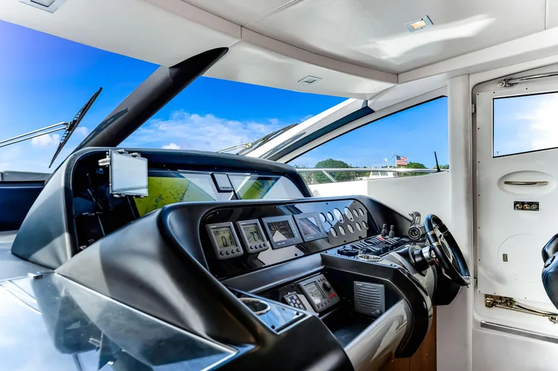 Slide: The Image of Cockpit of 2012 Sunseeker 74 Sport Yacht with modern navigation equipment and sleek design. - 15