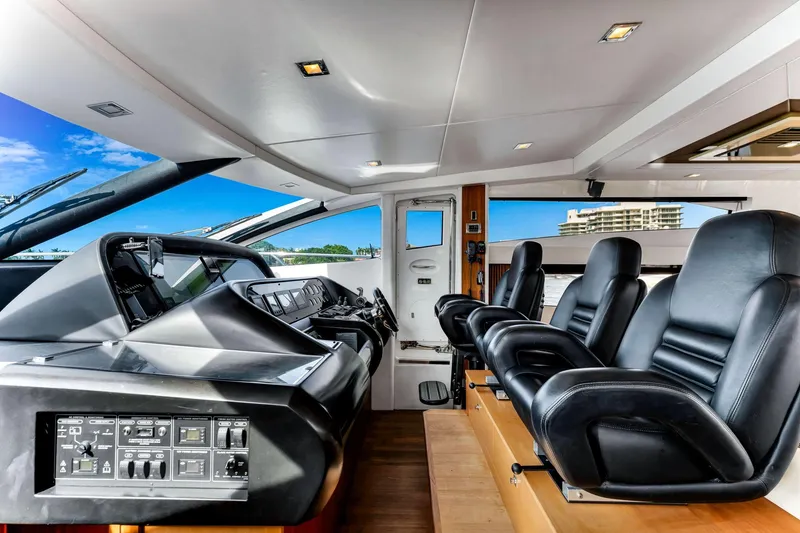 Slide: The Image of Interior of 2012 Sunseeker 74 Sport Yacht with luxurious black leather seating. - 16