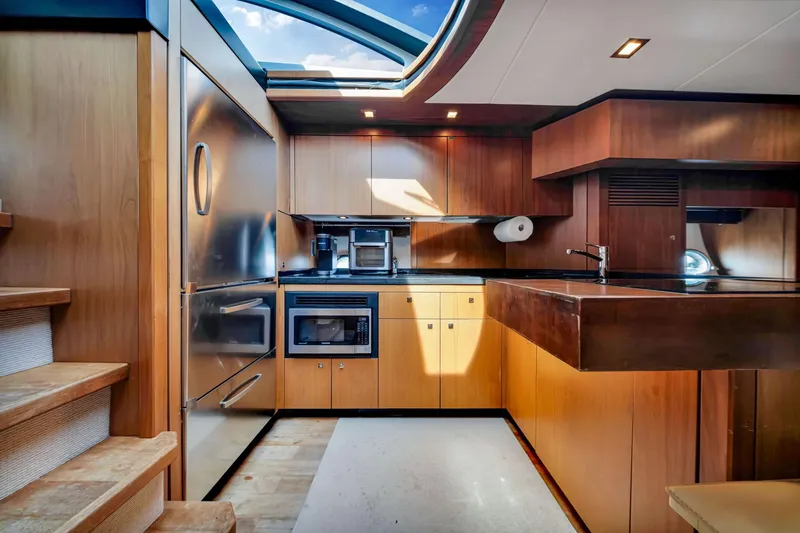 Slide: The Image of Luxurious kitchen interior of 2012 Sunseeker 74 Sport Yacht with modern appliances and wood finish. - 18