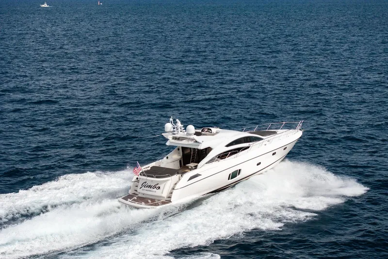 Slide: The Image of Sunseeker 74 Sport Yacht 2012 cruising on open sea, creating waves. - 2