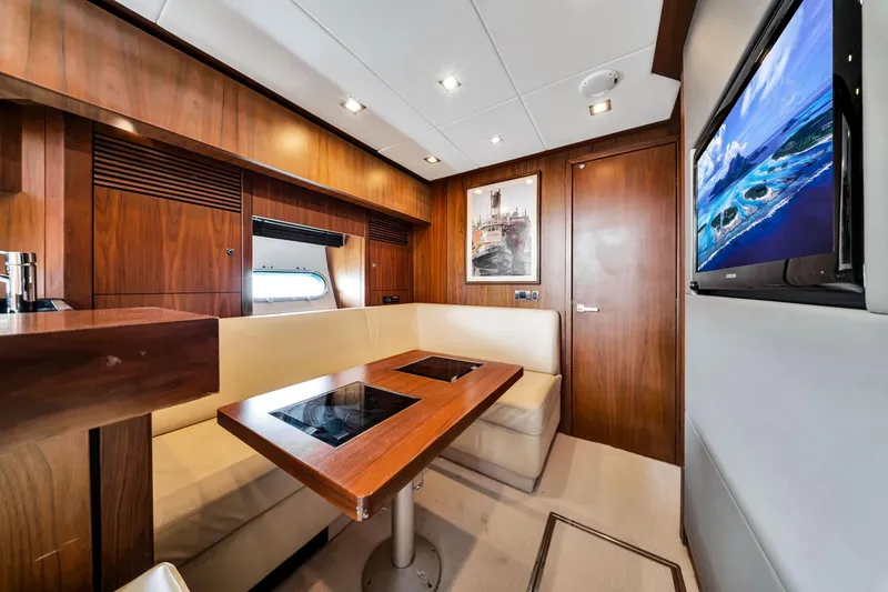 Slide: The Image of Luxurious interior of 2012 Sunseeker 74 Sport Yacht with wood paneling and modern amenities. - 22