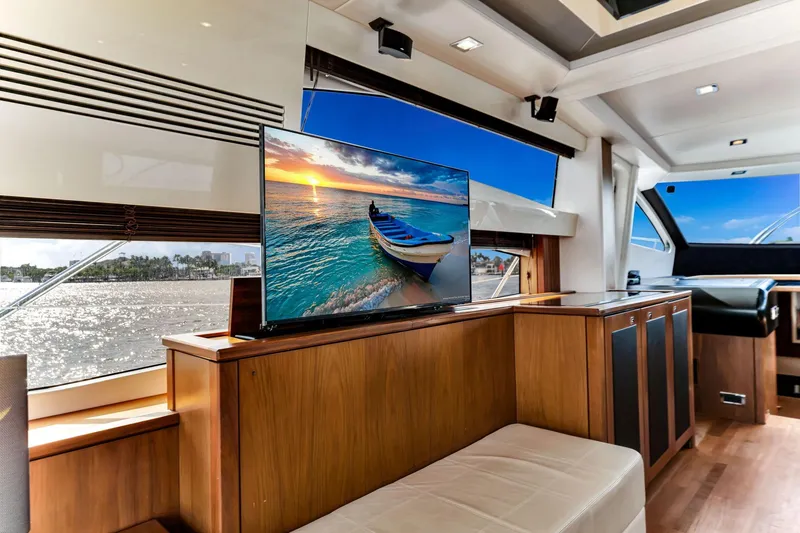 Slide: The Image of Luxurious interior of 2012 Sunseeker 74 Sport Yacht with scenic view on TV. - 23