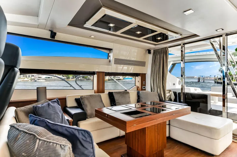 Slide: The Image of Luxurious interior of 2012 Sunseeker 74 Sport Yacht with elegant seating and waterfront view. - 24