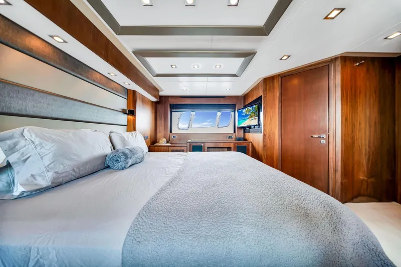Slide: The Image of Luxurious bedroom interior of 2012 Sunseeker 74 Sport Yacht with modern design and wood accents. - 29