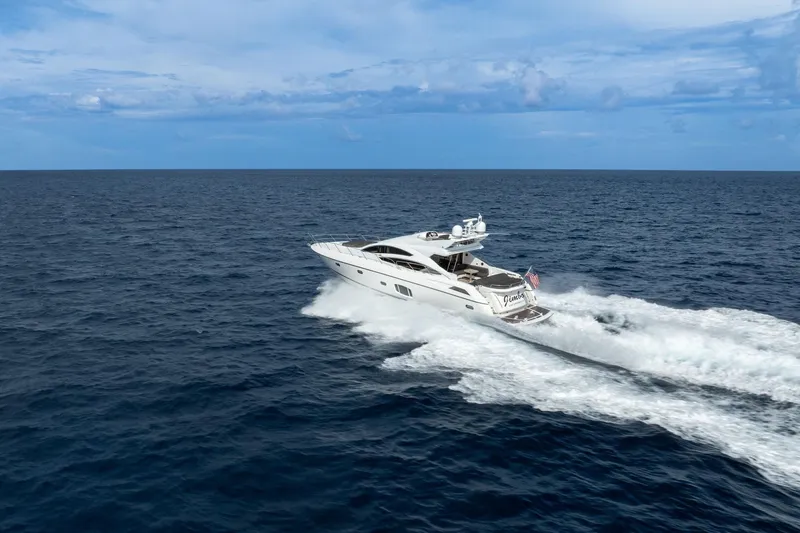 Slide: The Image of Sunseeker 74 Sport Yacht 2012 cruising on open sea under clear blue sky. - 3