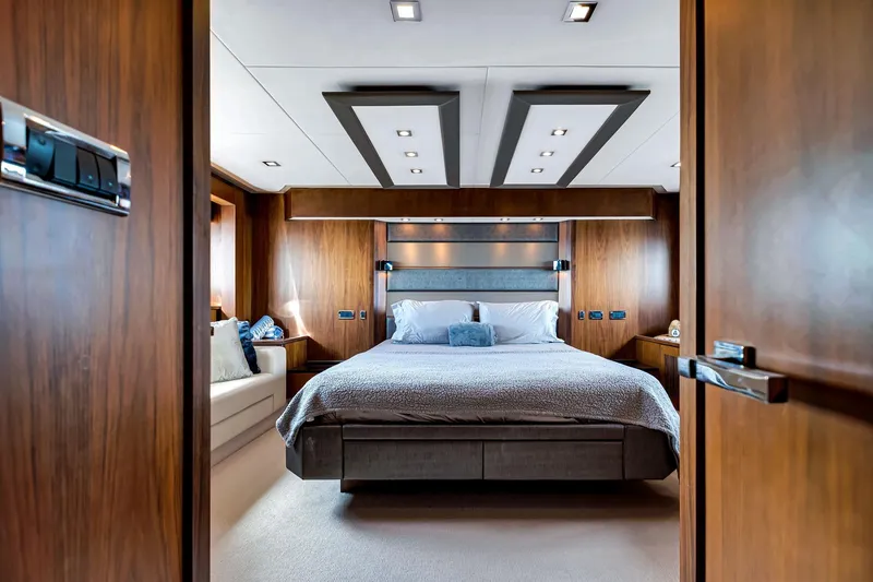 Slide: The Image of Luxurious bedroom interior of 2012 Sunseeker 74 Sport Yacht with modern wood paneling. - 30