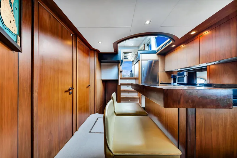 Slide: The Image of Luxurious interior of 2012 Sunseeker 74 Sport Yacht with wooden finishes and modern amenities. - 33