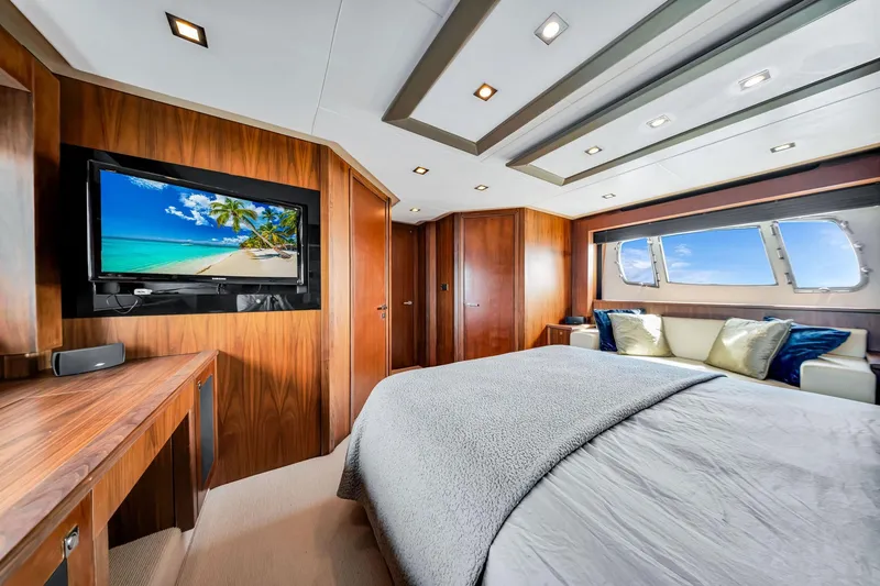 Slide: The Image of Luxurious Sunseeker 74 Sport Yacht 2012 bedroom with wood paneling and ocean view. - 34
