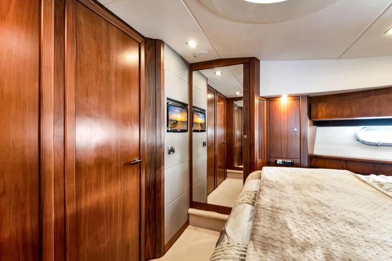 Slide: The Image of Luxurious interior of 2012 Sunseeker 74 Sport Yacht with elegant wood paneling and cozy bedding. - 37