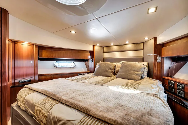 Slide: The Image of Luxurious cabin interior of 2012 Sunseeker 74 Sport Yacht with elegant bedding and wood finishes. - 38