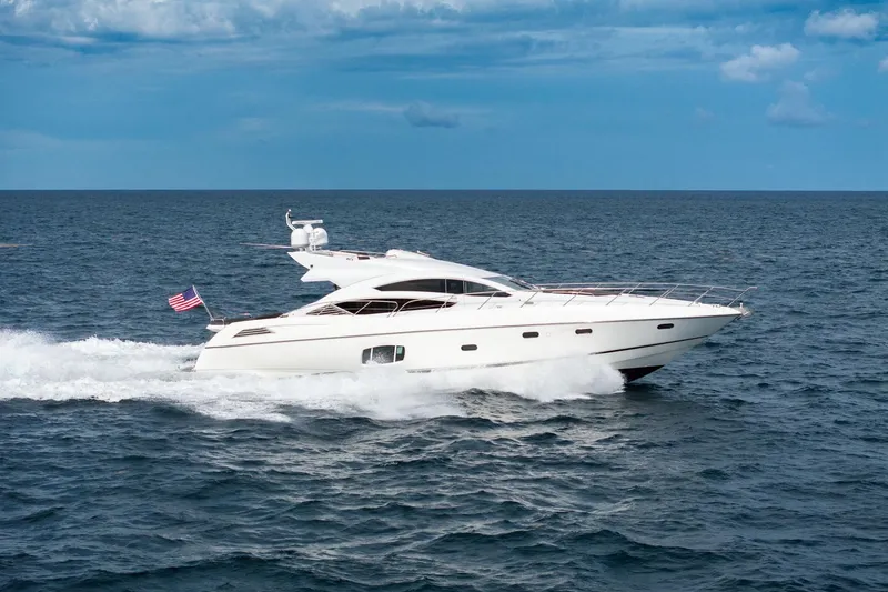 Slide: The Image of 2012 Sunseeker 74 Sport Yacht cruising on open sea under blue sky. - 4