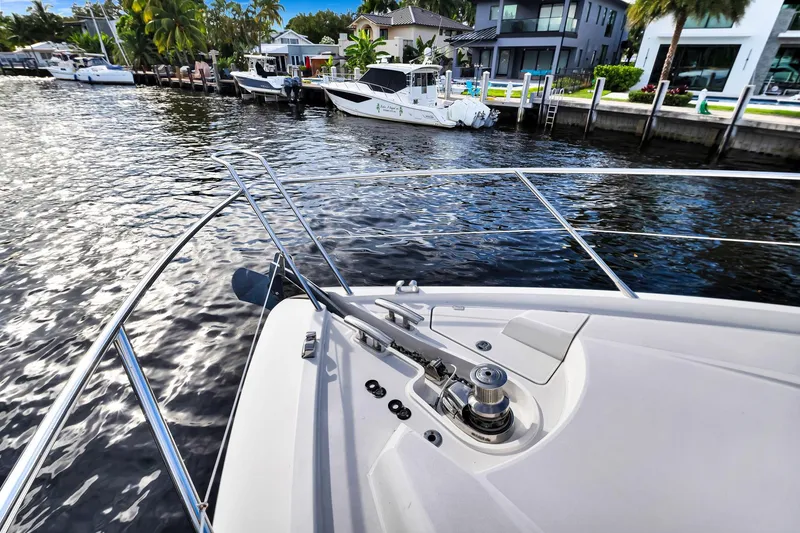 Slide: The Image of Bow view of 2012 Sunseeker 74 Sport Yacht docked by waterfront homes. - 47