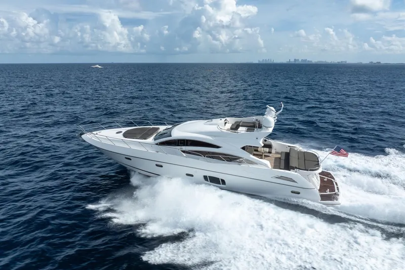 Slide: The Image of 2012 Sunseeker 74 Sport Yacht cruising on open ocean under clear skies. - 49