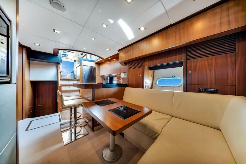 Slide: The Image of Luxurious interior of 2012 Sunseeker 74 Sport Yacht with modern kitchen and seating area. - 5