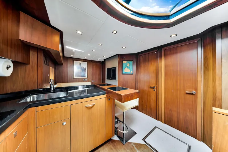 Slide: The Image of Luxurious interior of 2012 Sunseeker 74 Sport Yacht with modern wood finishes and skylight. - 6