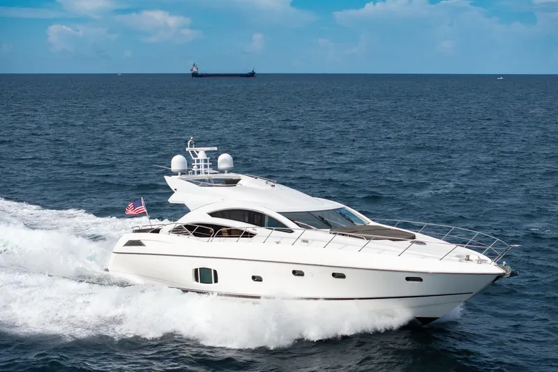 Slide: The Image of Sunseeker 74 Sport Yacht 2012 cruising on open sea with American flag. - 7