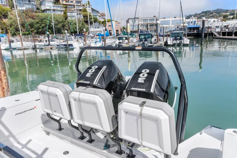 Slide: The Image of 2021 Axopar 37 XC BRABUS Trim Wet Bar with twin Mercury engines docked in marina. - 10