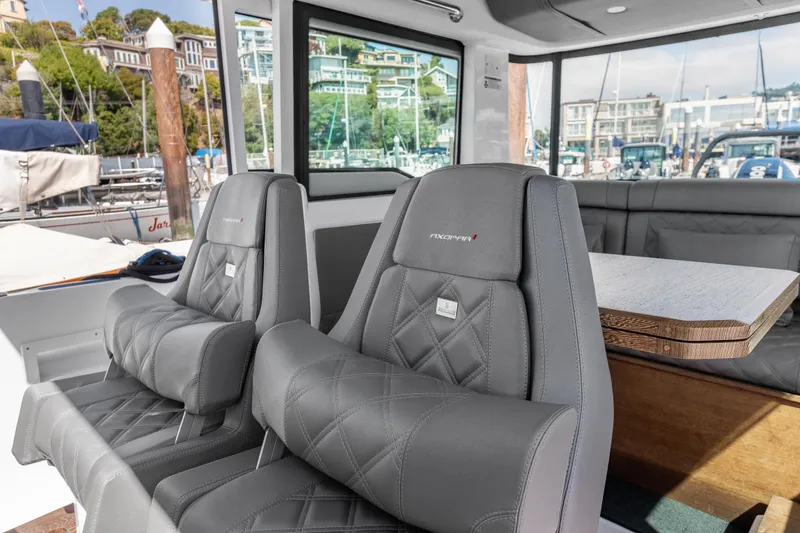 Slide: The Image of 2021 Axopar 37 XC BRABUS interior with luxury seating and wet bar. - 19