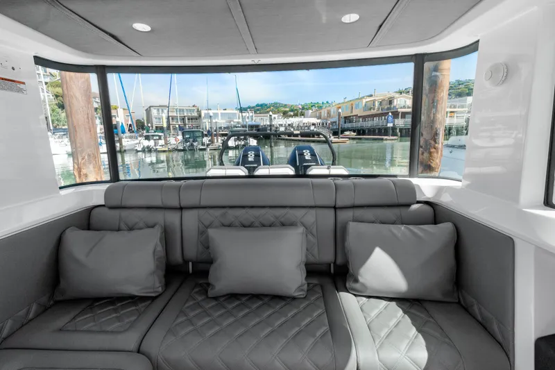 Slide: The Image of Interior view of 2021 Axopar 37 XC BRABUS Trim Wet Bar, featuring luxurious seating. - 23