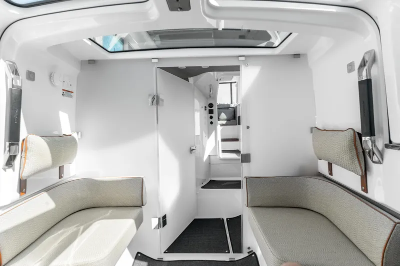 Slide: The Image of Interior of 2021 Axopar 37 XC BRABUS Trim Wet Bar, featuring seating and modern design. - 32