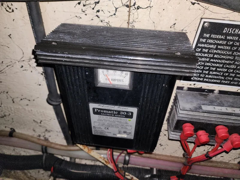 Slide: The Image of Electrical panel with Promatic 30-3 charger in a 2000 Rinker 340 Fiesta Vee boat. - 23