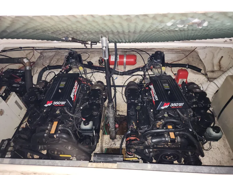 Slide: The Image of Twin Mercury 350 MAG engines in a 2000 Rinker 340 Fiesta Vee boat. - 24