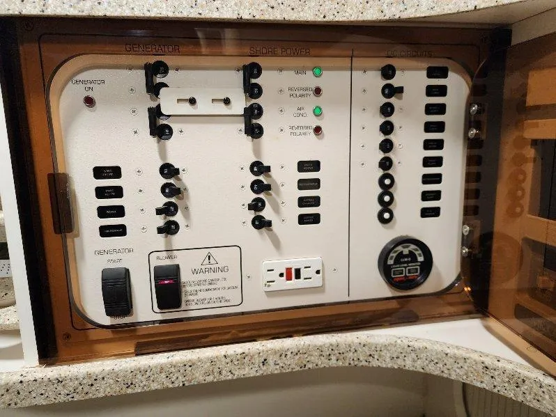 Slide: The Image of Electrical control panel on a 2000 Rinker 340 Fiesta Vee boat. - 25