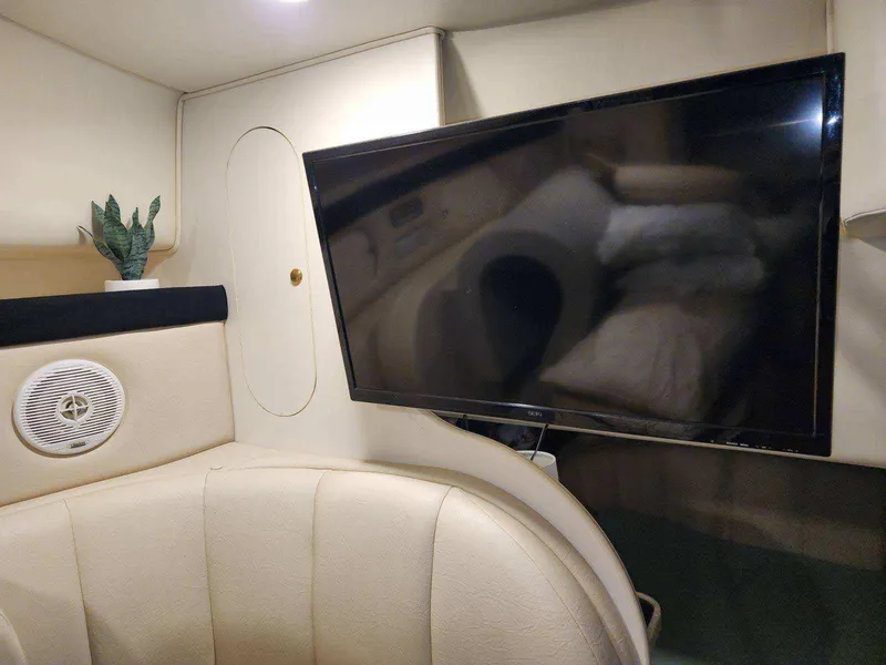 Slide: The Image of Interior of 2000 Rinker 340 Fiesta Vee with TV and speaker. - 31