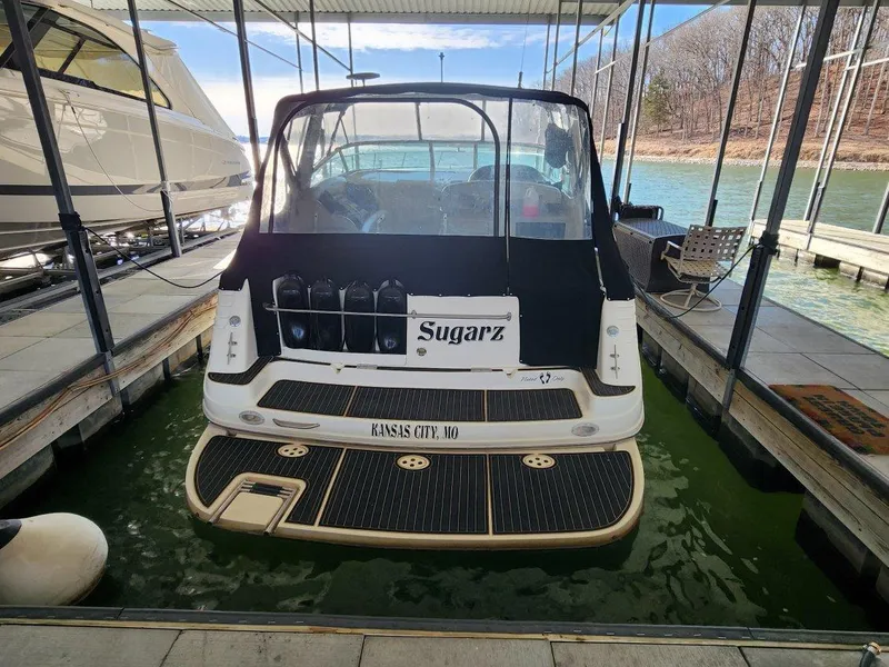 Slide: The Image of 2000 Rinker 340 Fiesta Vee docked, rear view, with "Sugarz" nameplate, Kansas City, MO. - 8