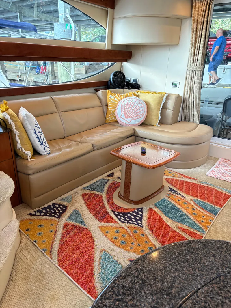 Slide: The Image of Luxurious 2006 Meridian Fly Bridge Convertible interior with leather seating and colorful decor. - 14