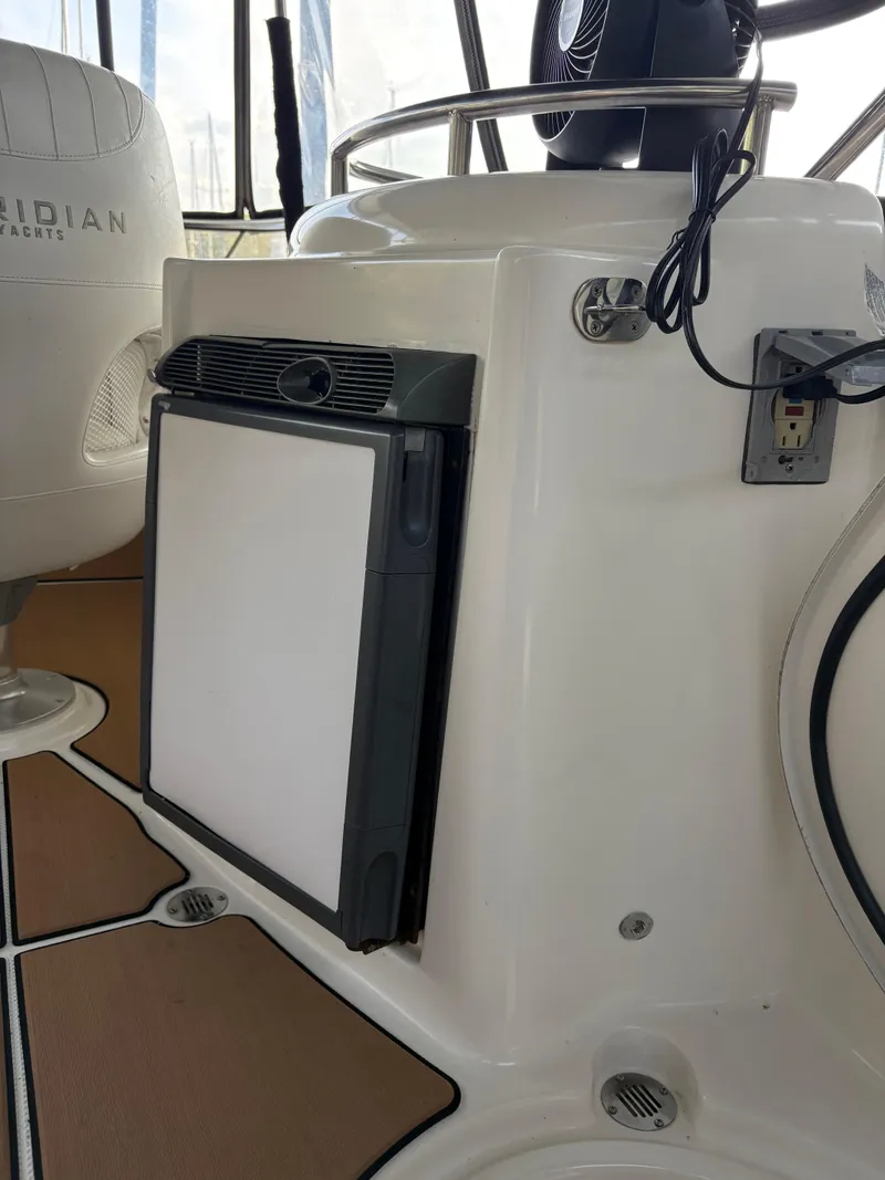 Slide: The Image of 2006 Meridian Fly Bridge Convertible interior with seating and equipment. - 4