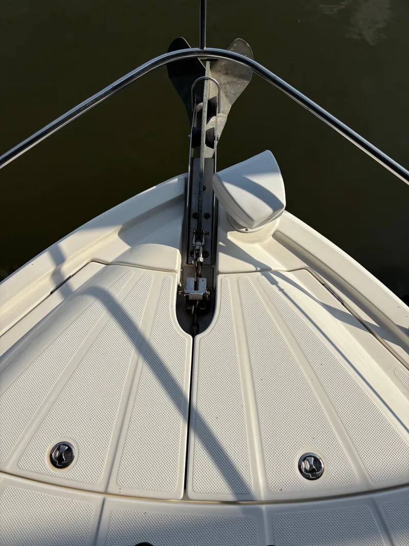 Slide: The Image of Bow of 2006 Meridian Fly Bridge Convertible boat with anchor and railings. - 5