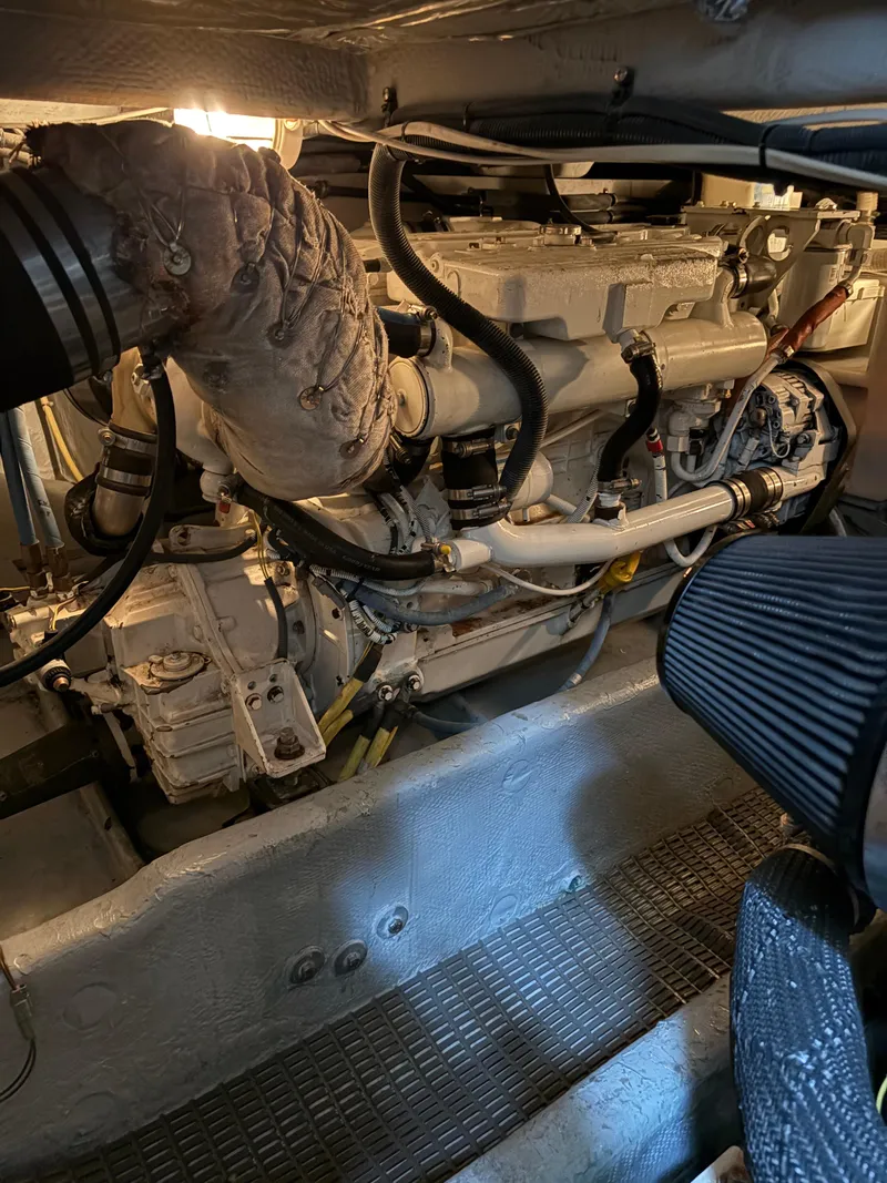 Slide: The Image of Engine room of a 2006 Meridian Fly Bridge Convertible boat, showcasing detailed machinery. - 8