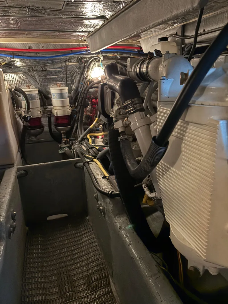 Slide: The Image of Engine room of a 2006 Meridian Fly Bridge Convertible boat, showcasing mechanical components. - 9