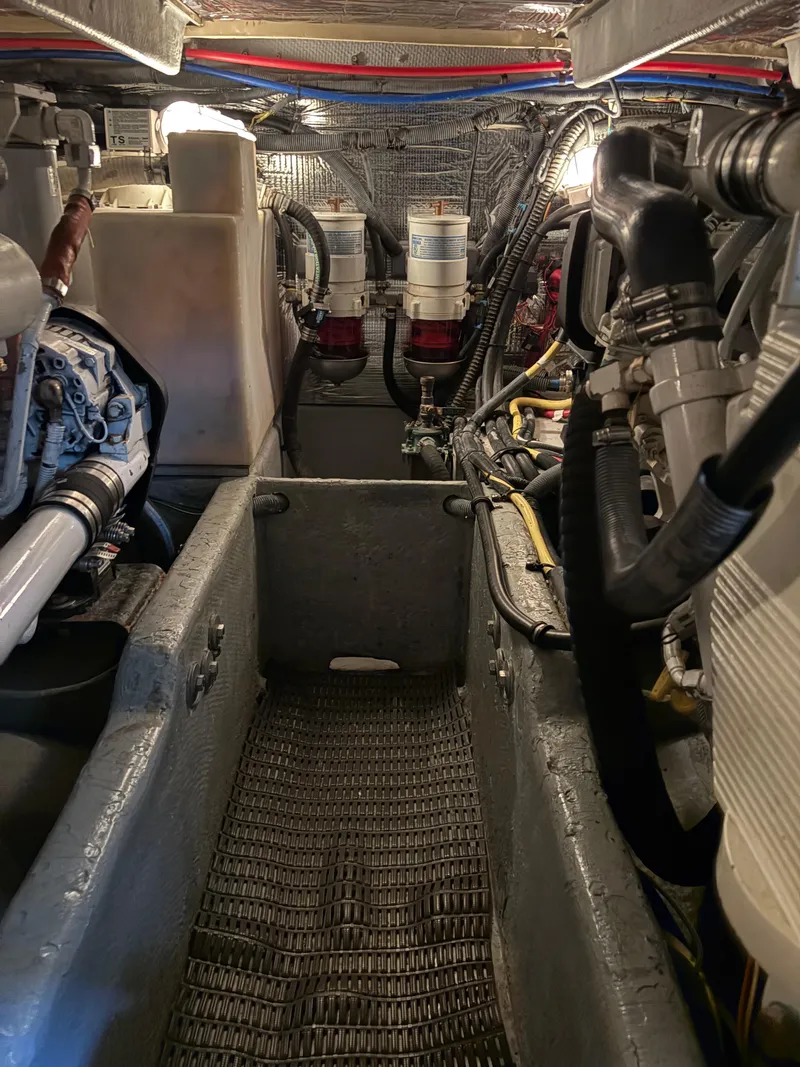 Slide: The Image of Engine room of a 2006 Meridian Fly Bridge Convertible boat, showcasing mechanical components. - 10