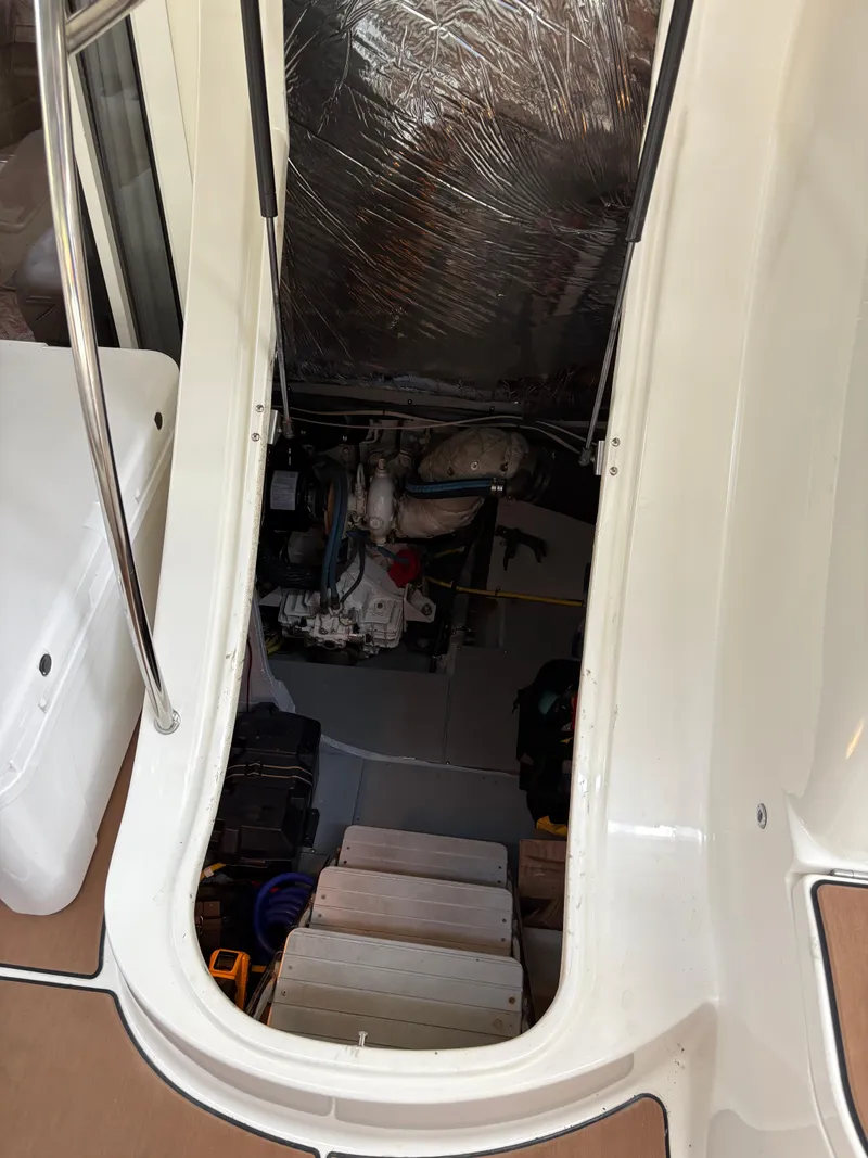 Slide: The Image of Engine compartment of a 2006 Meridian Fly Bridge Convertible boat, showing interior details. - 11