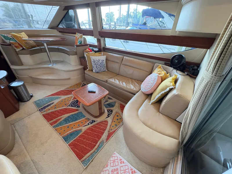 Slide: The Image of Luxurious 2006 Meridian Fly Bridge Convertible yacht interior with plush seating and vibrant decor. - 13